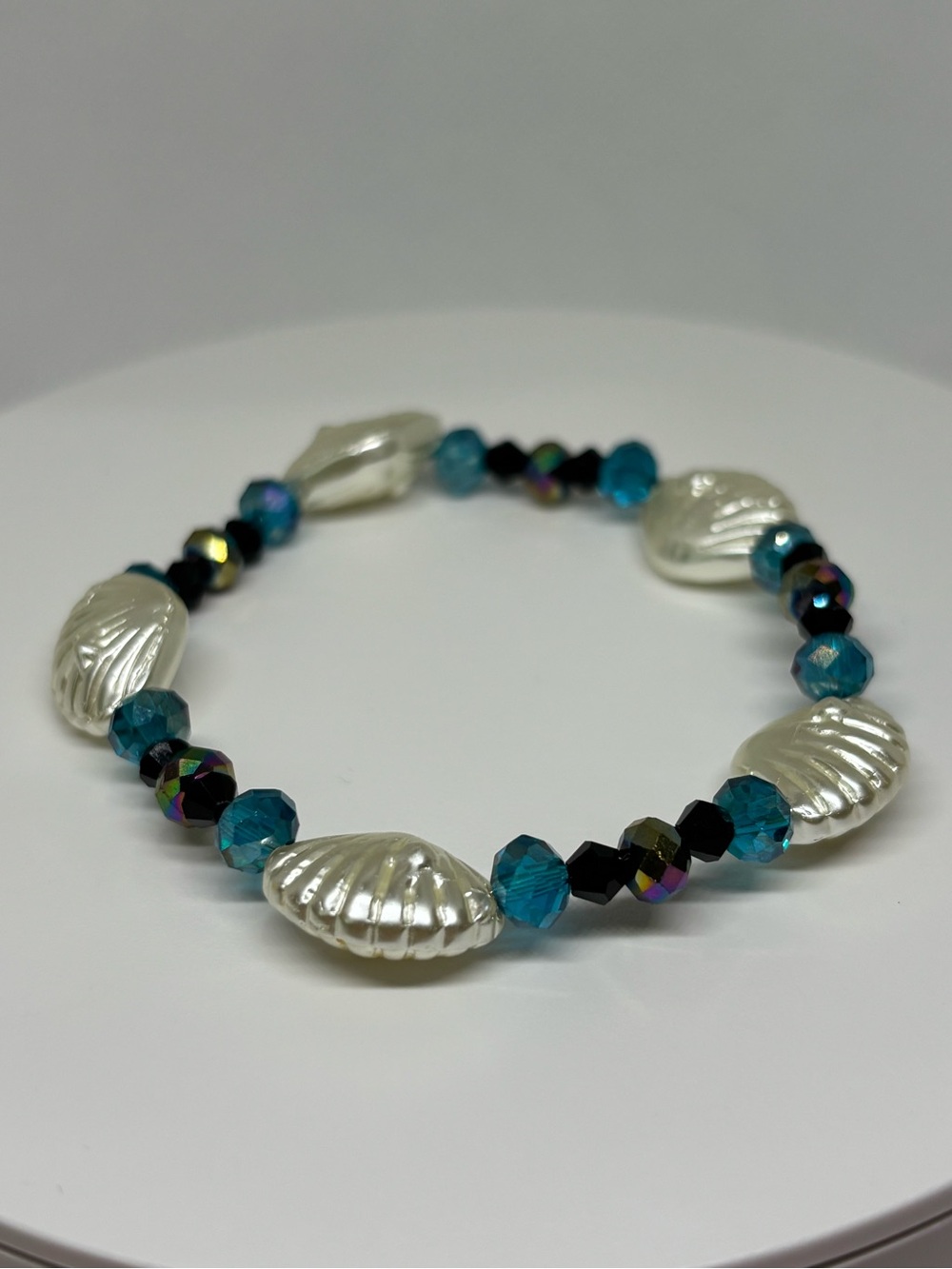 Hand Crafted All Glass Pearl Shell and Teal Crystal Stretch Bracelet